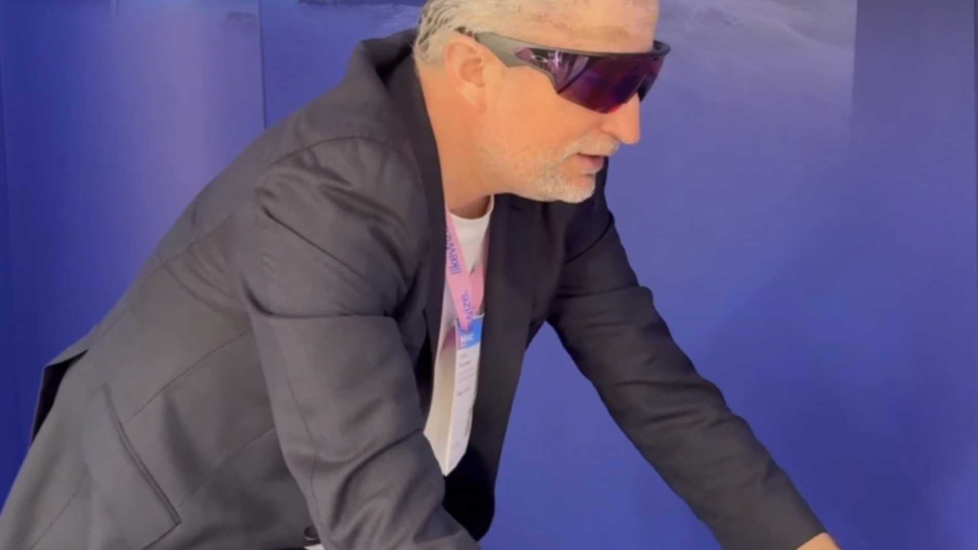 Ulrich Buckenlei testing a cycling simulation with Oakley Meta Vanguard AI Glasses at the Mobile World Congress 2026